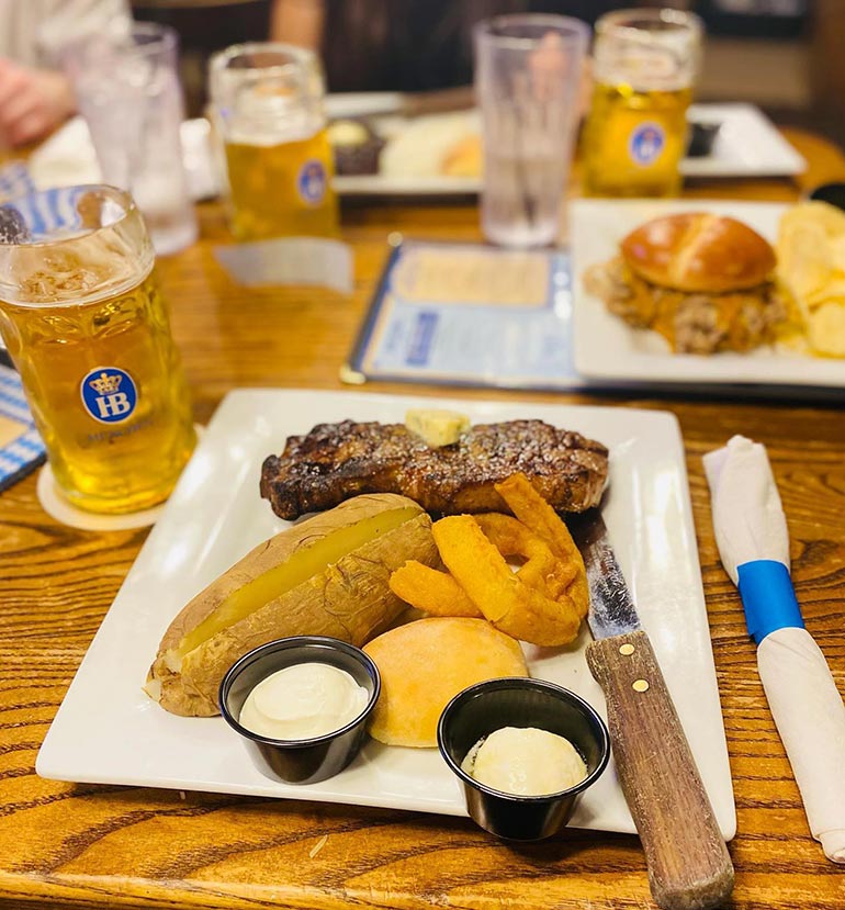 hefeweizen food pairings at hofbrauhaus including steak and potatos