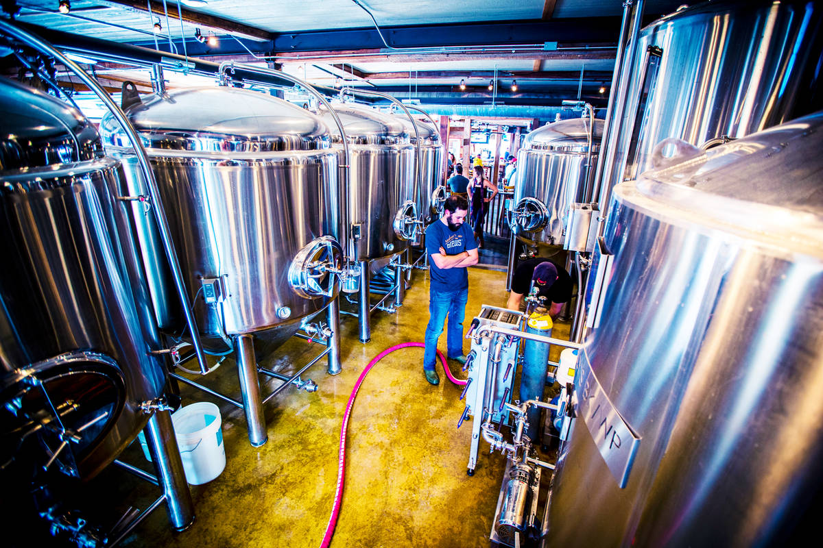 brewer stands in the middle of uncle billy's brewery brewhouse