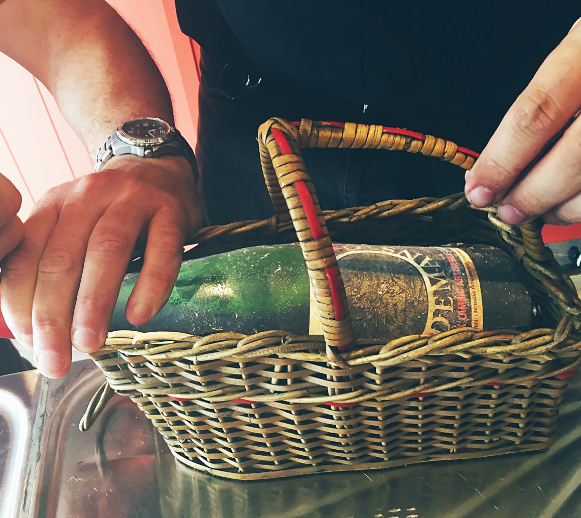 very old lindemans lambic in a lambic basket